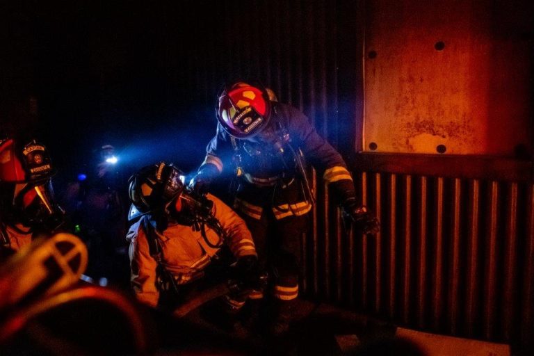 Group of firefighters at night